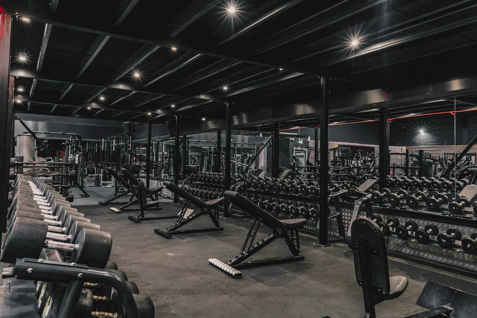 Gym floor with rows of exercise equipment