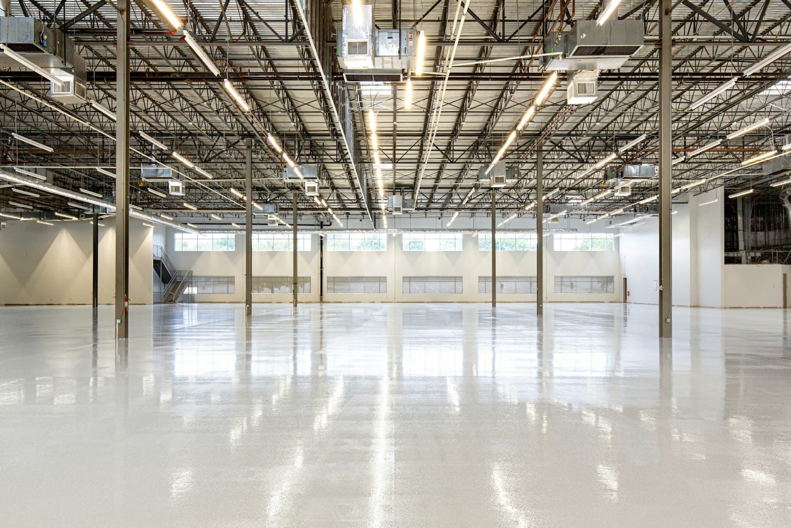 Empty warehouse with a clean polished concrete floor
