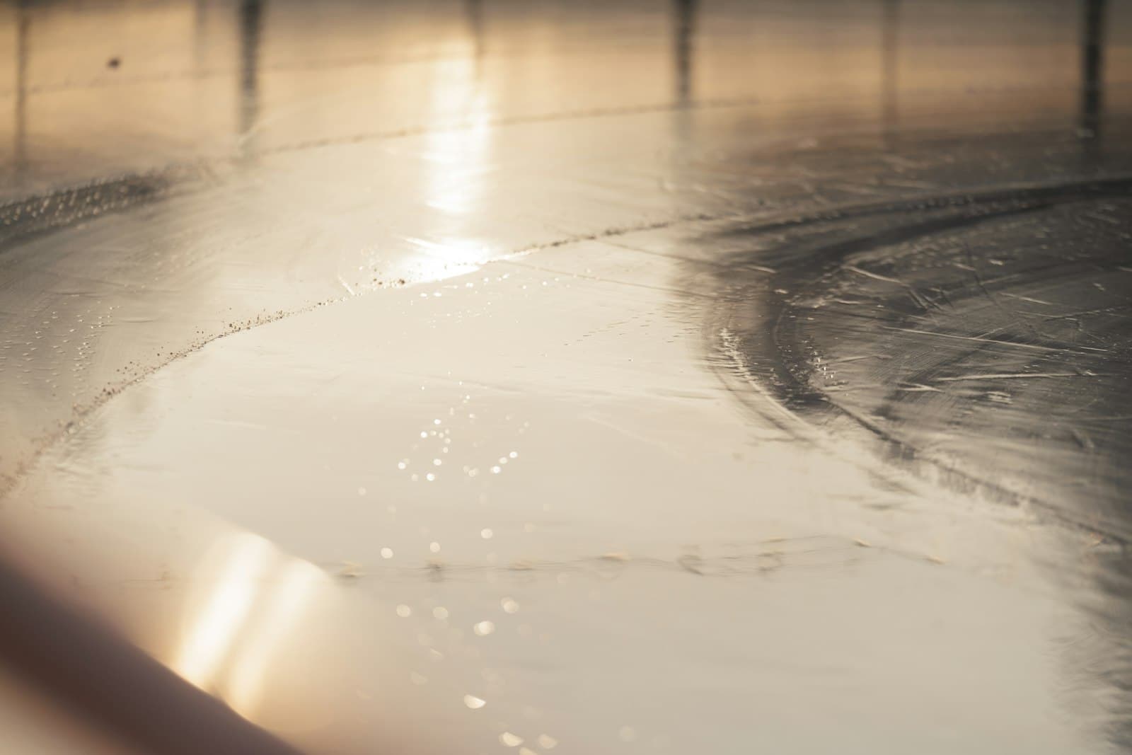 Water pooled across a hard floor